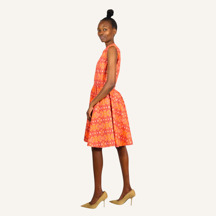 Orange print mali sleeveless dress with back opening and front zip closure