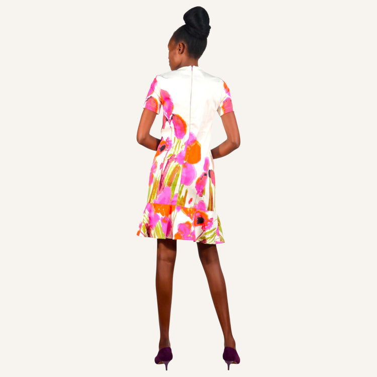 Off white floral round neck dress with a peplum